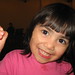 Maddy and the puppet hand say, "Hello"