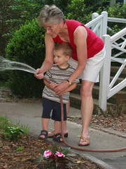 Watering the flowers with Grandma Barb